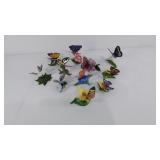 Eleven porcelain butterfly and flower figurines