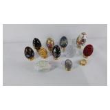 Group of decorative eggs most include a stand,