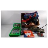 Toy group, army tank, legos, cars, a game, etc.