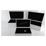 Group of three storage boxes, the 2 larger are