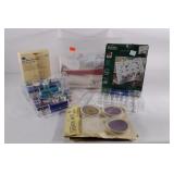 Sewing group, thread boxes, 1 is empty, fabrics,