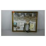 Hanging wall display of costume jewelry, ear