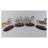 Group of four Lenox Carousel porcelain figurines