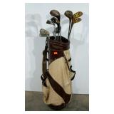 Golf bag with clubs, 5 drivers, wooden, one is