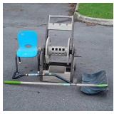Group lot includes water hose Reel, garden hoe,