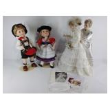 Group of four collectors dolls by the Danbury