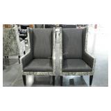 Two upholstered arm chairs, wear on arms, leg