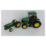 John Deer toy tractors, the larger one is hard