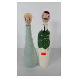 Two figural painted decanter bottles, one has