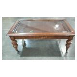 Rattan topped coffee table with glass overlay, on