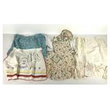 Four vintage aprons, embroidered kids themed