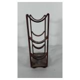 Cast iron wine bottle holder, holds three