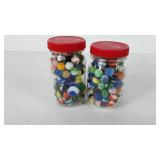 Two Kraft jars full of marbles