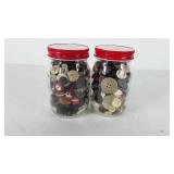 Two oysters jars full of buttons