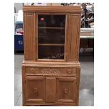 China cabinet with carved front design, one