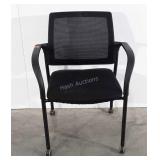 Mesh backed office arm chair