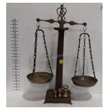 Decorative brass and wooden scale with weights,