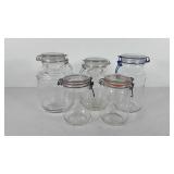 Five glass canisters