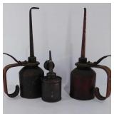 Three old oil cans