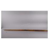 Pool sticks, missing a piece of inlay, has