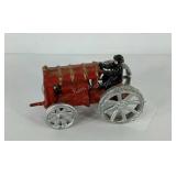 Cast iron man on tractor, 6