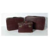 Three leather suitcases