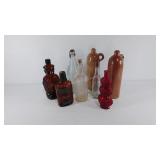 Glass bottles and ceramic jugs