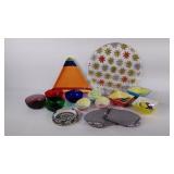Colorful dishes, bowls, butter knives, plates,