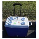 Rubbermaid blue Wheeled Cooler, corner damage