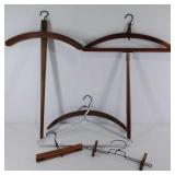 Group of six Old Hangers, two pant/skirt hangers,