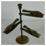 Old brass notes sorter with hands as clips