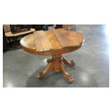 Round 44" diameter pedestal table with carved