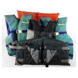Five life vests, condition as shown, in tote