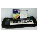 Yama ha PSR-12 keyboard with music books for