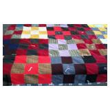 Flannel backed, knotted patchwork quilt in nice