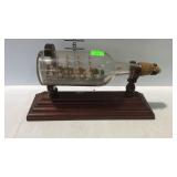 Ship in the bottle with stand