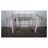 Table having stainless steel top sitting on top