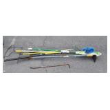 Group of long handled tools takes, mop, crowbar