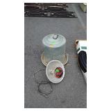 Galvanized chicken feeder and heat lamp