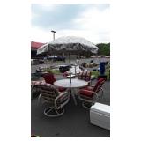 Glass top patio table 48" in diameter with four