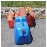 Three poly Fuel Cans, one 5 gallon kerosene, and