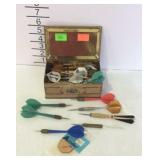 Darts in a vintage candy tin