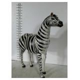 Standing zebra statue. Unsure of material. Shows
