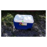 Blue igloo cooler on wheels