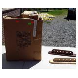 Large box full of wall racks for pool sticks