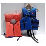 Two life vests the blue is adult super large