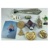 9 brooches and a pin
