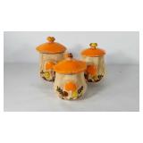 Three ceramic mushroom canisters, 
Iids have