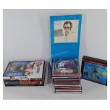 Group of DVDs, CDs, and an Audio Book