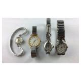 Four wrist watches none are running